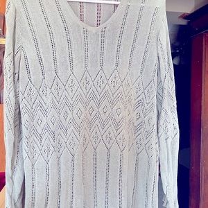Light pretty green sweater.  Very high quality